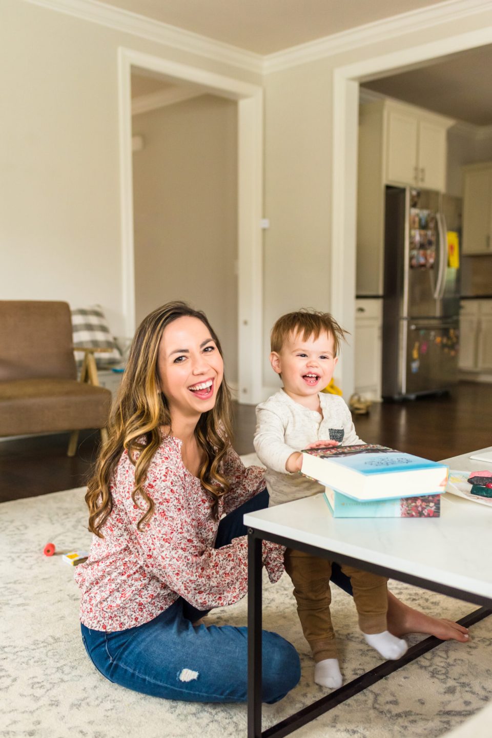 bringing-God-into-your-business-as-a-Christian-business-owner woman sitting on the floor reading the Bible with her toddler